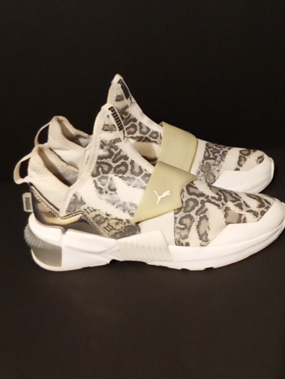 The sneaker in your image is the PUMA Provoke XT Mid Untamed in the "Metallic